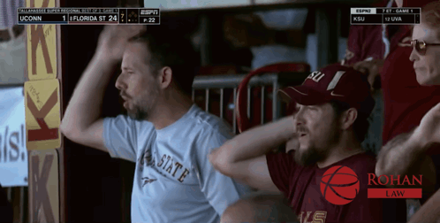 A Man Wearing A Florida State Shirt Is Watching A Basketball Game GIF
