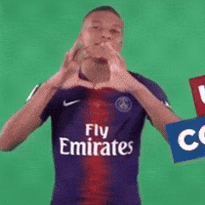 A Man Wearing A Fly Emirates Jersey Makes A Heart Shape With His Hands GIF