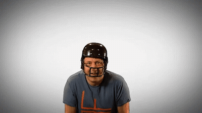 A Man Wearing A Football Helmet And A T-Shirt With A L On It GIF