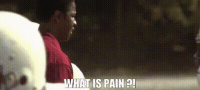 A Man Wearing A Football Helmet Is Asking What Is Pain GIF