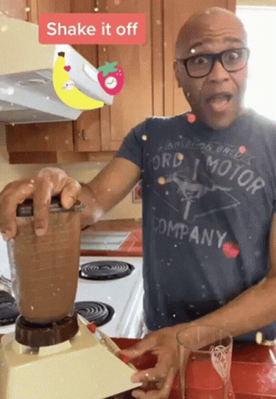 A Man Wearing A Ford Motor Company Shirt Shakes A Blender GIF