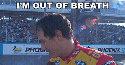 A Man Wearing A Ford Shirt Is Talking Into A Microphone GIF