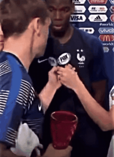 A Man Wearing A Fox Logo On His Shirt GIF