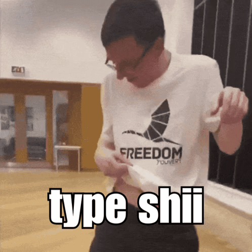 A Man Wearing A Freedom T-Shirt Is Dancing In A Room GIF