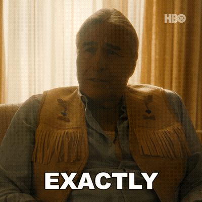 A Man Wearing A Fringed Vest Is Sitting On A Couch And Says Exactly GIF