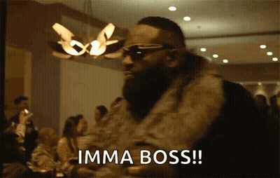 A Man Wearing A Fur Coat And Sunglasses Says Imma Boss GIF
