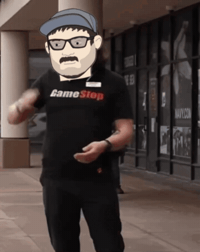 A Man Wearing A Game Stop Shirt Is Standing In Front Of A Building GIF