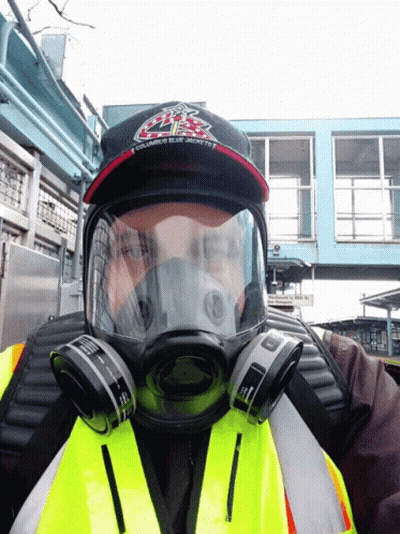 A Man Wearing A Gas Mask And A Hat That Says Ubc GIF