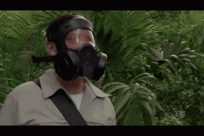 A Man Wearing A Gas Mask Is Standing In A Jungle With The Letters Ctv Hd On The Bottom Right GIF