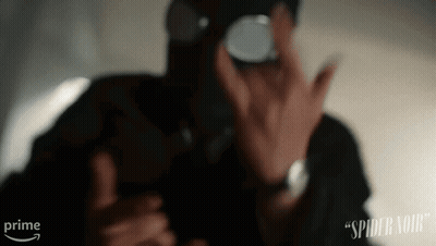 A Man Wearing A Gas Mask Is Taking A Picture Of Himself With A Prime Arrow Behind Him GIF