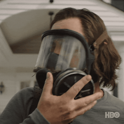 A Man Wearing A Gas Mask With Hbo Written On The Bottom Right GIF