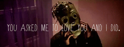 A Man Wearing A Gas Mask With The Words " You Asked Me To Love You And I Did " Below Him GIF