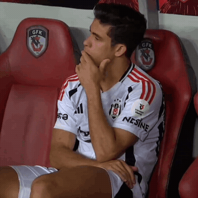 A Man Wearing A Gfk Jersey Sits In A Locker Room GIF