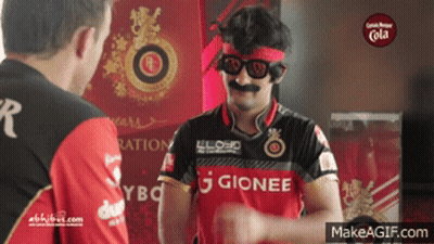 A Man Wearing A Gionee Shirt Is Talking To Another Man GIF