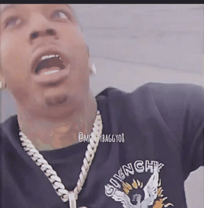 A Man Wearing A Givenchy T-Shirt And A Necklace GIF