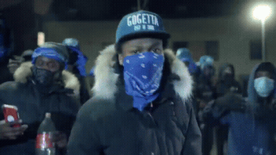 A Man Wearing A Gogetta Hat And A Blue Bandana GIF
