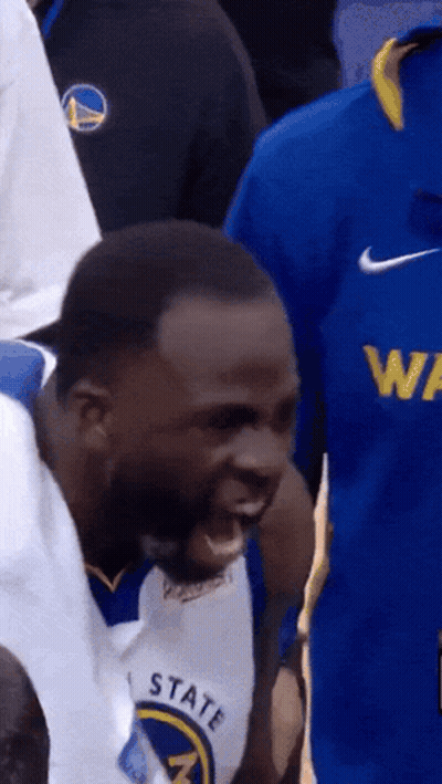 A Man Wearing A Golden State Warriors Jersey Is Yelling GIF