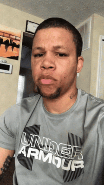 A Man Wearing A Gray Under Armour Shirt GIF