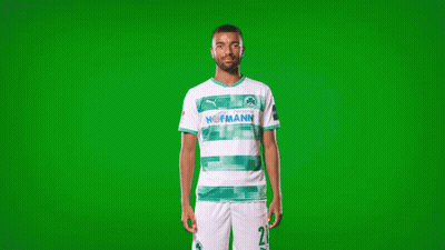 A Man Wearing A Green And White Hofmann Soccer Jersey GIF