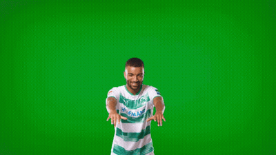 A Man Wearing A Green And White Shirt That Says Holland GIF