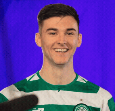 A Man Wearing A Green And White Striped Shirt That Says Celtic Football Club Smiles GIF