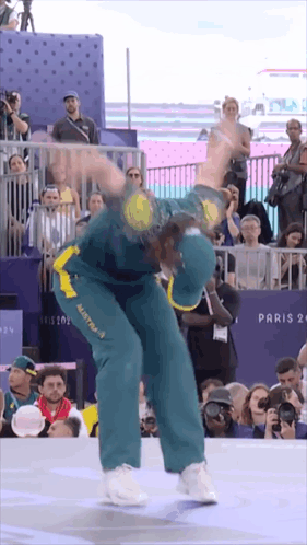 A Man Wearing A Green And Yellow Jersey With Australia On It GIF