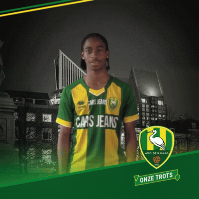 A Man Wearing A Green And Yellow Shirt That Says Cars Jeans On It GIF