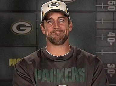 A Man Wearing A Green Bay Packers Shirt GIF