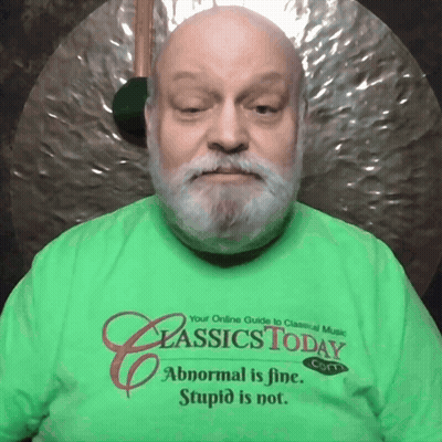 A Man Wearing A Green Classics Today T-Shirt GIF