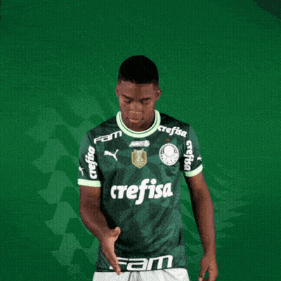 A Man Wearing A Green Crefisa Jersey Shakes Hands GIF