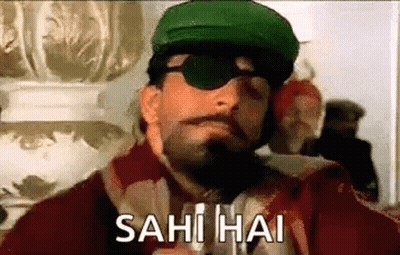 A Man Wearing A Green Hat And Sunglasses Is Smoking A Cigarette And Says Sahi Hai . GIF