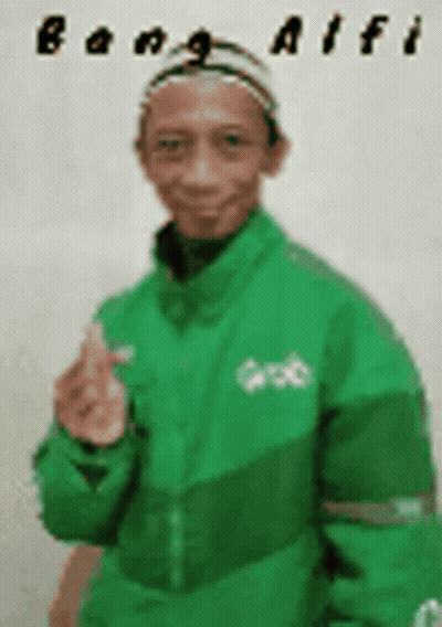 A Man Wearing A Green Jacket And A Hat Is Giving A Thumbs Up . GIF