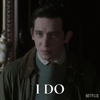 A Man Wearing A Green Jacket And A Sweater Says I Do GIF