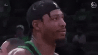 A Man Wearing A Green Jersey With The Words Fuck Marcus Smart GIF