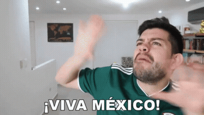 A Man Wearing A Green Jersey With The Words Viva Mexico On It GIF