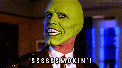 A Man Wearing A Green Mask And A Suit Says Sssss Smokin ' GIF