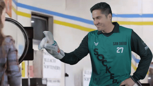 A Man Wearing A Green San Diego 27 Jersey GIF