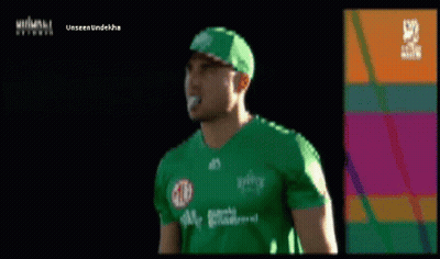 A Man Wearing A Green Shirt And A Green Hat With The Word Unseen Underneath GIF