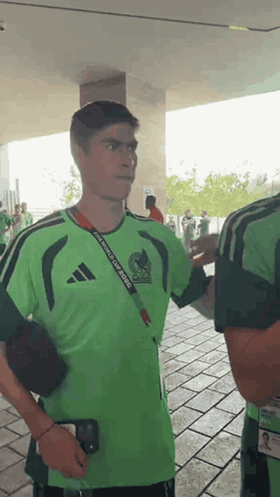 A Man Wearing A Green Shirt That Says Fifa World Cup Mexico GIF