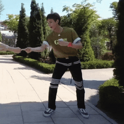 A Man Wearing A Green Shirt That Says G On It GIF