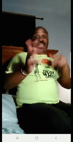 A Man Wearing A Green Shirt That Says " Third Their Last " On It GIF