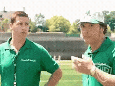 A Man Wearing A Green Shirt That Says ' Ucsd ' On It Stands Next To Another Man GIF