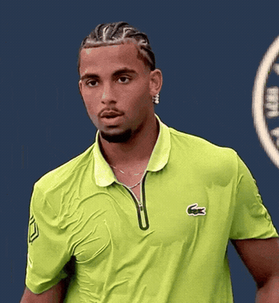 A Man Wearing A Green Shirt With A Lacoste Logo On The Front GIF