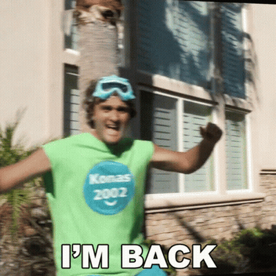 A Man Wearing A Green Shirt With Konas 2002 On It GIF