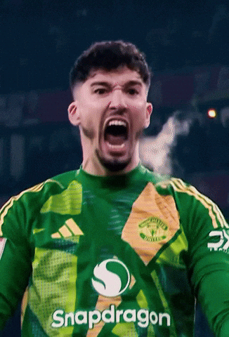 A Man Wearing A Green Shirt With Snapdragon On The Front GIF