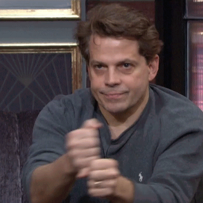 A Man Wearing A Grey Polo Shirt With A White Horse On The Sleeve GIF