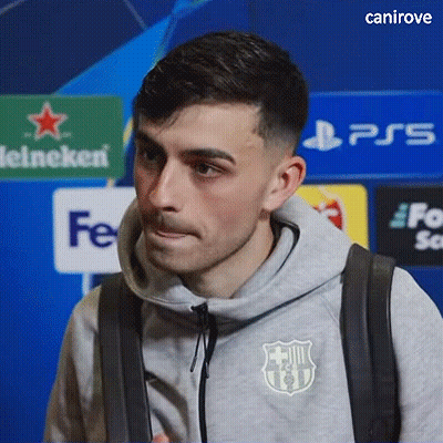 A Man Wearing A Grey Sweatshirt With A Fcb Logo On It GIF