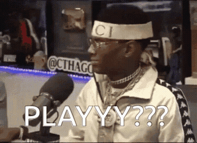 A Man Wearing A Gucci Headband Is Sitting In Front Of A Microphone And Says Playyy GIF