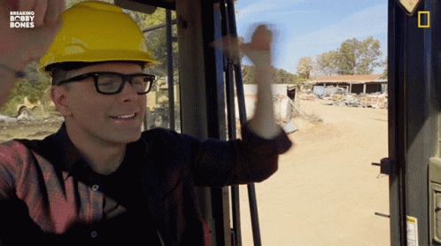 A Man Wearing A Hard Hat And Glasses Is On A Breaking Bobby Bones Tv Show GIF