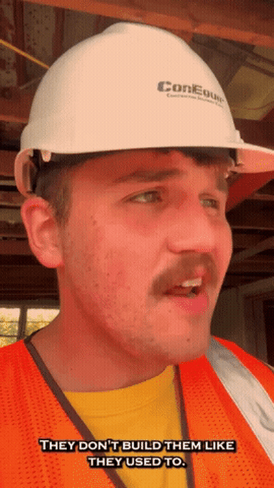 A Man Wearing A Hard Hat And Orange Vest Says They Don 'T Build Them Like They Used To GIF